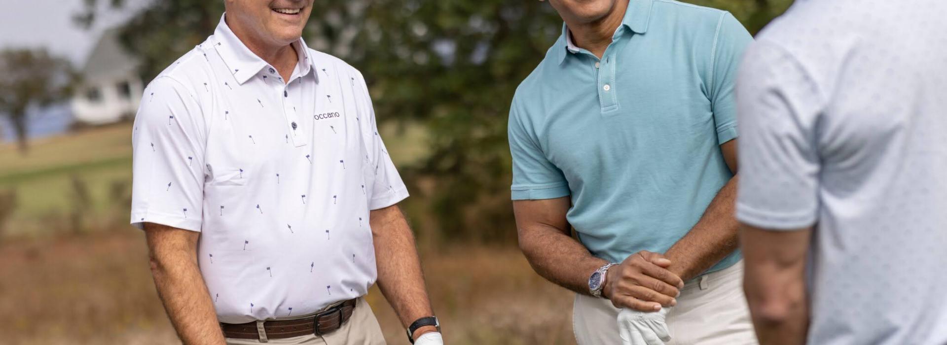Players smiling on golf course
